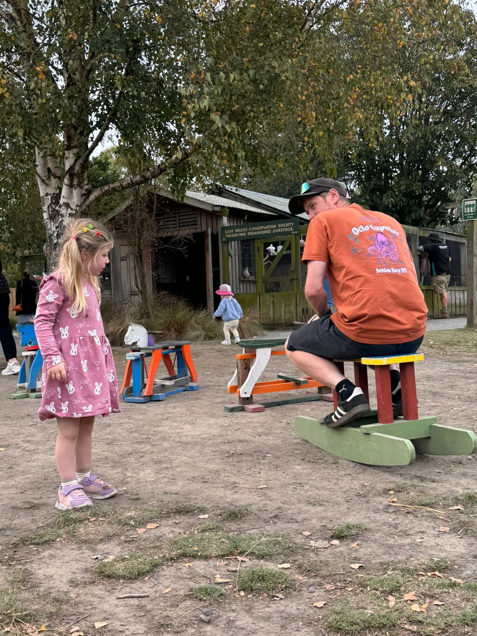 Michael with his daughter at a Canterbury playground picnic table